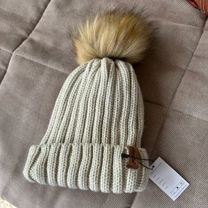Winter hat with removable snap pom pom